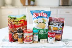 an assortment of food items sitting on top of a table