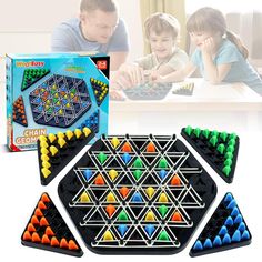 an adult and child playing with magnetic tiles