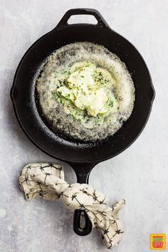 a skillet with some food inside of it