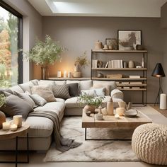 a living room filled with lots of furniture next to a large glass window and a white rug