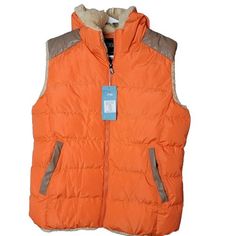 This Stylish Men's Puffer Vest By Zshow Is Perfect For Any Outdoor Activity Or Casual Occasion. The Vest Features A Solid Orange Color With Quilted Accents And A Sherpa Lined Hood For Added Warmth. The Jacket Is Made From Polyester And Is Machine Washable For Easy Care. It Has A Regular Fit And A Zip Closure, With Chest Size Measuring At 42 Inches And Size L. The Vest Is Suitable For Winter, Fall, And Spring Seasons And Can Be Worn For Everyday Activities Or Hiking. The Performance And Activity Sporty Orange Outerwear For Outdoor Activities, Sporty Orange Outerwear For Outdoor, Functional Orange Hooded Outerwear, Orange Hooded Outerwear For Outdoor Activities, Orange Outerwear With Pockets For Outdoor Activities, Functional Orange Outerwear For Fall, Orange Outerwear For Sports In Fall, Winter Sports Brown Outerwear, Orange Outerwear With Pockets For Outdoor