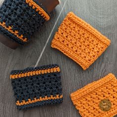 three crocheted items sitting on top of a wooden table