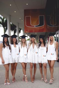 a group of women in graduation caps and gowns