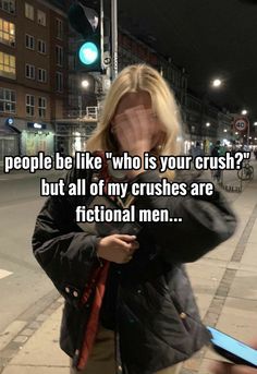 a woman standing on the street with her head in her hands and texting people like who is your crush? but all of my crushes are fictional men