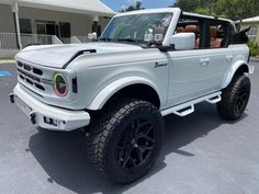 a white truck parked in a parking lot