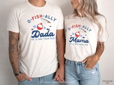 a man and woman wearing matching tshirts that read o - fish ally and dada of a one year old