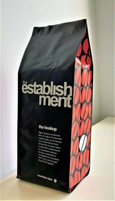 a black bag with red and white designs on it that says the establishment ment