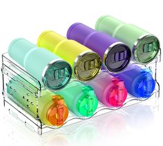 four different colored pill holders in a holder