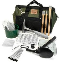 an assortment of gardening tools and utensils laid out in front of a tool bag