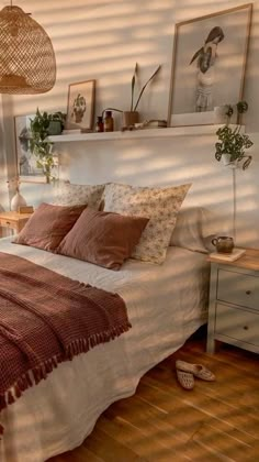 a bed sitting in a bedroom next to a window with blinds on the windowsill