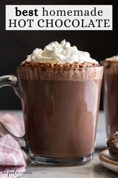 two cups of hot chocolate with whipped cream on top and the words, best homemade hot chocolate