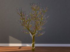 there is a small tree with lights on it in the middle of a room,