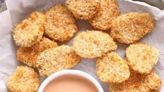 some fried food on a plate with dipping sauce