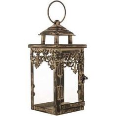 an old fashioned metal lantern with filigrees