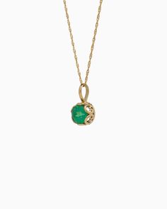 Crafted in 14K solid gold, the Princess Petroglyph Stone Pendant features a faceted green zircon stone encircled by intricate petroglyphs. Its unique design adds a touch of elegance to any outfit, and pairs wonderfully with our Princess Petroglyph Stone Studs. Metal: 14K solid gold Stone: Green zircon Dimensions: 16mm x 8mm Stone Size: 8mm Style #: GP160GZ Gold Jewelry With Bezel Setting For May Birthstone, Heirloom Jewelry With Gemstone For May Birthstone, Heirloom Gemstone Jewelry For May Birthstone, Exquisite Round Green Emerald Necklace, Timeless Green Jewelry With Bezel Setting, Elegant Hallmarked Green Emerald Necklace, Heirloom May Birthstone Jewelry With Gemstone, Green Birthstone Pendant Jewelry, Classic Emerald Necklace As Birthstone In Yellow Gold