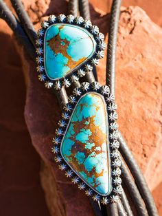 Beautiful large chunks of natural Royston turquoise. Each bead is hand made and soldered one by one. Our roo leather is beautiful quality, and professionally braided by the best in the west! Sterling tips. 32 to 36 inch lengths. Offered in two sizes Mas Grande and Ultimate. Your Welcome to contact us for actual available pieces. Bohemian Turquoise Lariat Bolo Tie, Handmade Southwestern Turquoise Bolo Ties, Handmade Artisan Turquoise Bolo Ties, Artisan Handmade Turquoise Bolo Ties, Handmade Western Turquoise Necklace For Festival, Handmade Rustic Adjustable Turquoise Necklace, Your Welcome, Royston Turquoise, Hand Made