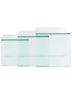 three clear glass boxes sitting on top of each other in front of a white background