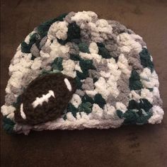 Brand New Handmade Crochet Baby Hat Made With Super Soft Chunky Yarn And Hand Sewn Football Appliqu Will Fit Infant Newborn (Hat Circumference) (0-3 Months ) 12” ( 0-6 Months ) 14” (0-12 Months) 16” Average Infant Sizes And Will Stretch A Little D/T Elasticity Of Yarn Can Make Custom Colors And Sizes For Your Favorite Team Just Ask Makes A Great Gift For That Bundle Of Joy That Arrives During Football Season Baby Football, Crochet Baby Hat, Football Baby, Newborn Hat, Bundle Of Joy, Crochet Baby Hats, Baby Hat, Chunky Yarn, Football Season