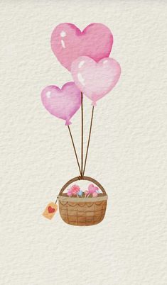 three heart shaped balloons floating in a basket