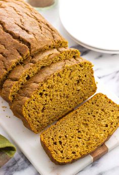 sliced pumpkin bread on a cutting board with the text, naturally sweetened pumpkin bread