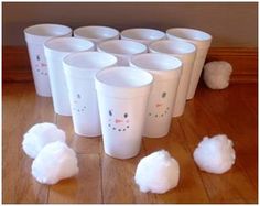 there are many cups that have cotton balls on the floor