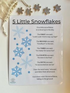 a snowflake poem is displayed on a table