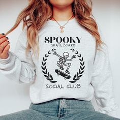 Gift For Skater Spooky Skeleton Sweatshirt Skateboarder Sweatshirt Hoodie Gifts Skateboard Social Club Crewneck Ghost Skateboard Hoodie Gift Thank you for supporting me and for visiting my store! PRODUCT Gildan Unisex Sweatshirt.These garments are made from polyester and cotton. High quality materials and digital printing are used in the production of all of our items.  HOW TO ORDER 1. Please review all the information provided before placing an order 2. Choose the color of your item from the fi Skeleton Sweatshirt, Spooky Skeleton, Skateboarder, Social Club, Spooky Season, Sweatshirt Hoodie, Digital Printing, Unisex Sweatshirt, Tumble Dryer