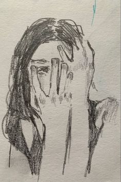 a drawing of a woman covering her face