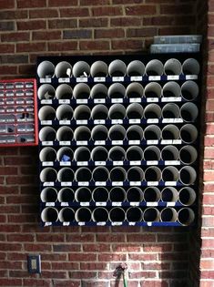 there is a large rack with many cups on it and a bicycle parked next to it