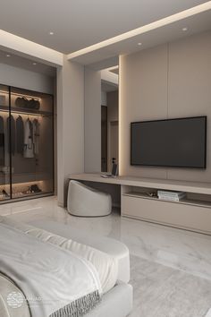 a bedroom with white furniture and a flat screen tv mounted on the wall above it