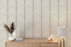 an art deco styled wallpaper design in beige and white, with two vases on the dresser