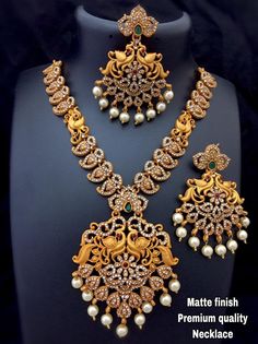 Traditional Matte Gold Bridal Jewellery South Indian Temple Jewelry Necklace With Earrings Set Gold Plated Handmade Indian Jewelry for women Materials: alloy Plating: Gold plated Stone type: Artificial Stone Style: Boho & hippie Please contact us for Bulk Orders. Occasions: Wedding Wear, Party Wear, Festive Wear, Durga Puja, Indian Wear, Sangeet Wear, Bridal Wear, Chrismas Day, Mothers Day, Haldi Wear. NOTE *Actual color may vary slightly from your monitor. *We dispatch the product within 5 Gold Bridal Jewellery, South Indian Necklace, Jewellery South Indian, Necklace With Earrings Set, Haldi Wear, South Indian Temple, Traditional Wedding Jewellery, Temple Jewelry Necklace, Pakistani Bridal Jewelry