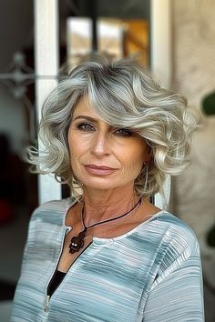 Woman with a voluminous jaw-length wavy bob in silver and charcoal tones Wavy Bob, Wavy Bobs, Age Defying