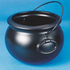 a black pot with a handle on a blue background