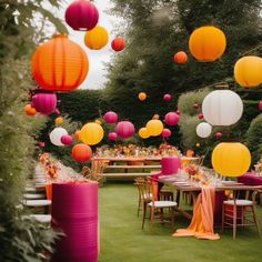 an outdoor party with paper lanterns and tables