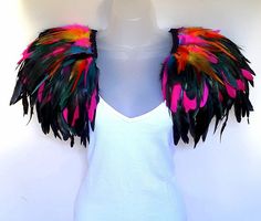 a white mannequin with colorful feathers on it