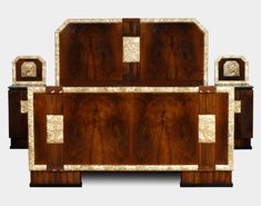 an art deco style bed with wooden headboard and foot board inlaided with mother of pearl