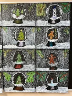 several snow globes with christmas trees in them