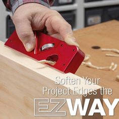 a man is working on some wood with the words ez way written below it