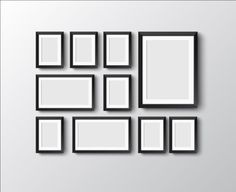 a group of black and white frames hanging on a wall