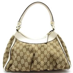 Introducing the Gucci Abby Handbag, a timeless blend of sophistication and style. Crafted with GG canvas and leather in a chic beige hue, this shoulder bag exudes luxury and elegance. The iconic Gucci logo is subtly featured, adding a touch of designer flair to any outfit.Designed for the modern woman on the go, the Gucci Abby Handbag offers both fashion and functionality. The spacious interior provides ample room for all your essentials, while the adjustable shoulder strap ensures comfort and versatility. Whether for a casual day out or a special evening event, this bag is the perfect accessory to elevate your look.Make a statement with the Gucci Abby Handbag - a must-have piece for every fashion-forward individual. Elevate your style game with this exquisite designer bag that effortlessl Louis Vuitton Multicolor, Gucci Logo, Balenciaga Bag, Celine Bags, Hermes Bags, Designer Bag, Fendi Bags, Canvas Leather, Prada Bag