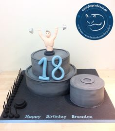 a birthday cake with a man lifting a barbell