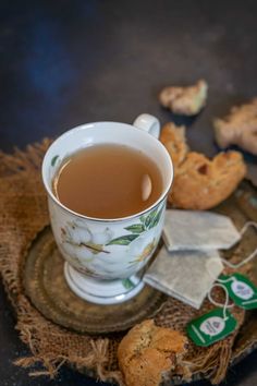 a cup of tea and some cookies on a table