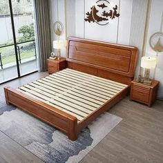 a bed room with a neatly made bed and two night stands