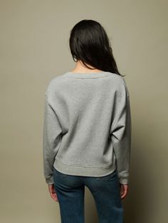 Off-shoulder, on shoulder, whatever. We can't tell you what to do. But we can tell you this varsity-inspired V neck is as effortless and comfortable as it is chic. (This one comes in Heather Grey.) | Women's Wyatt Sweatshirt in Heather Grey | Ethical Essentials Relaxed Fit Sweatshirt For Everyday, Nation Ltd, Smooth Face, Sweater Blazer, Ulla Johnson, Shirt Accessories, Grey Fabric, V Neck Tops, World Of Fashion