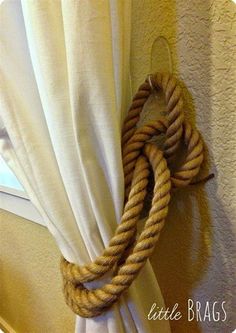 a rope hanging from the side of a curtain