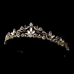 Gold Plated Scroll Wedding TiaraThis stunning tiara has a modern vintage design. The light gold plated floral scroll design is accented with brilliant crystal rhinestones for just the right amount of sparkle. This headpiece will be a  beautiful finishing touch to your elegant bridal look.Size: The decorated portion of the piece measures 8" wide and 1" tall. Color: Gold/Clear.Style: hp8312g.Also available in silver plating as hp8312.Available with matching jewelry set as 8312.Please allow 1 week Golden Headpiece, Simple Wedding Flowers, Wedding Day Tips, Crystal Tiara, Beautiful Tiaras, Gold Tiara, Headpiece Jewelry, Accesories Jewelry, Light Style