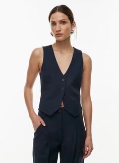 Babaton DENIRO VEST | Aritzia US Elegant Wool Vest For Workwear, Elegant Wool Vest For Office, Elegant Sleeveless Wool Vest, Elegant Single Breasted Vest For Fall, Elegant Semi-formal Wool Vest, Classic Sleeveless Wool Top, Fitted Wool Vest Top, Classic Tailored Vest For Fall, Fitted Vest With Button Closure For Work