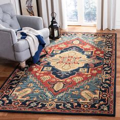 a living room area with a chair and rug