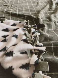 a blanket with black and white designs on it